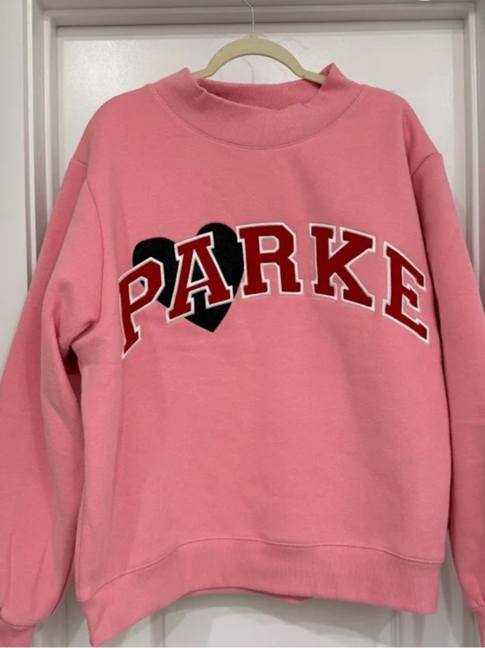 Parker Pink Crewneck Sweatshirt with Black Heart Graphic